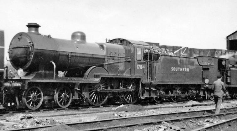 Freshly repaired L1 at Ashford Locomotive Depot
6th July 1946
SR Maunsell L1 class no.1784 (built April 1926, withdrawn February 1960) has clearly just been through Ashford Works, which were across the Canterbury line from the Locomotive Running Depot. 
Ashford’s 1947 allocation of 60 locomotives comprising 4 off 4-6-0, 14 off 4-4-0, 8 off 2-6-0, 5 off 0-6-4T, 11 off  0-6-0, 3 off 0-6-0T, 14 off 0-4-4T and 1 off 0-4-2T.
“This pre-nationalisation shot in 1946 was one my earliest”.
© Ben Brooksbank (CC-by-SA/2.0)
