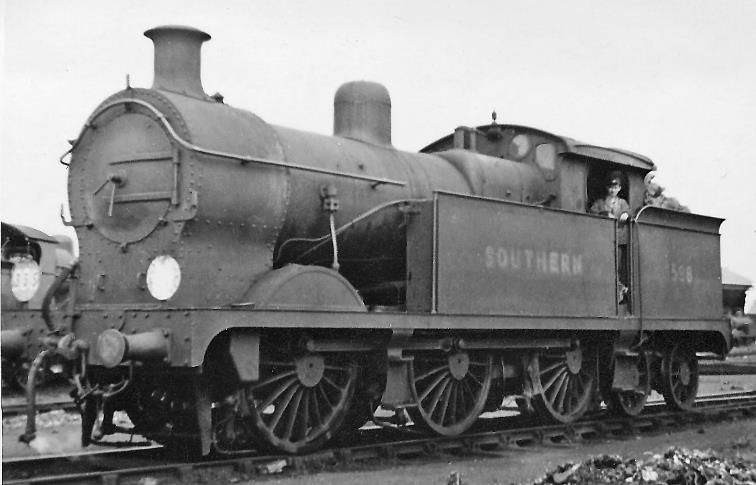 A rare J-class at Ashford Locomotive Depot
6th July 1946
There were only five of these large SECR Wainwright J-class locomotives, built originally for London outer-suburban services but were redundant after electrification. No.1598 dated from November 1913 and was withdrawn in December 1950.
© Ben Brooksbank (CC-by-SA/2.0)
