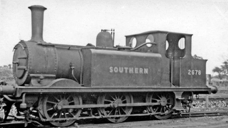 Ex-LBSCR A1X at Ashford Locomotive Depot
6th July 1946
No.2678 was built July 1880 as Stroudley class A1 no.678 'Knowle', was rebuilt as an A1X November 1911; it ran on the SR it as B678, was sent in 1925 to the Isle of Wight as W4, then W14 'Bembridge', returned in 1937 and loaned to the Kent & East Sussex line until 1954, finally ran as BR 32678 on the SR until withdrawn October 1963..
© Ben Brooksbank (CC-by-SA/2.0)
