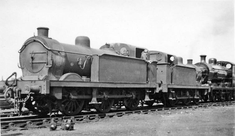 Two ex-SER R1 locomotives with cut-down cabs.
6th July 1946
Ex-SER Stirling class R1 nos.1069 (built June 1898) and 1147 (built November 1890) had cut-down cabs to operate on the restrictive Canterbury & Whitstable line, but were engaged here in shunting ex-Works engines; both withdrawn in August 1958.
© Ben Brooksbank (CC-by-SA/2.0)

