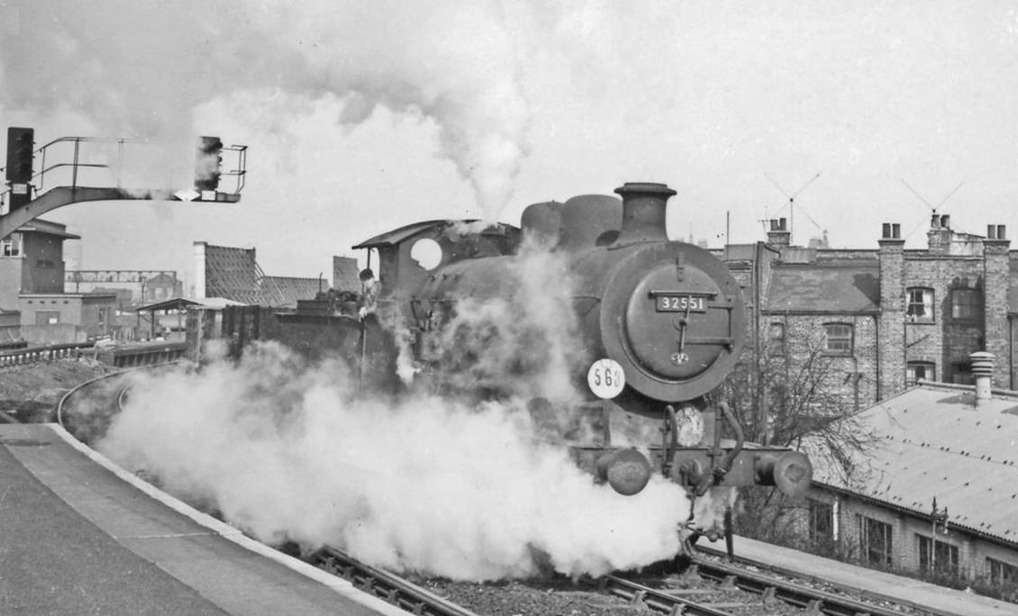Freight off the West London Extension Line struggles 
onto the Brighton Section at Clapham Junction
2nd April 1958
From Platform 15/16, towards Pig’s Hill, Latchmere Junction and the West London Extension to Kensington Olympia and Willesden Junction. The locomotive is R. Billinton C2X class no.32551 (built February 1902 as C2 no.551, rebuilt February 1909, withdrawn February 1960). On the left is Clapham Junction 'B' Box, controlling the Central (ex-LBSCR) lines.
© Ben Brooksbank (CC-by-SA/2.0)
