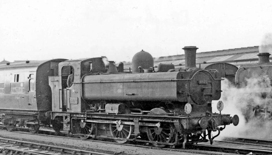 Ex-GWR Pannier tank on empty stock work at Clapham Junction
23rd December 1959
View northward from platform 8, with the extensive Carriage Depot off to the left. In 1959 for a few years in the later days of Steam, ex-GWR Pannier tanks were brought across to help with the important movement of empty stock to/from Waterloo. This is Collett '8750' class 0-6-0PT no.4672 (built March 1944, withdrawn July 1963). Behind can be glimpsed a BR Standard 4-6-0.
Ben Brooksbank (CC-by-SA/2.0)