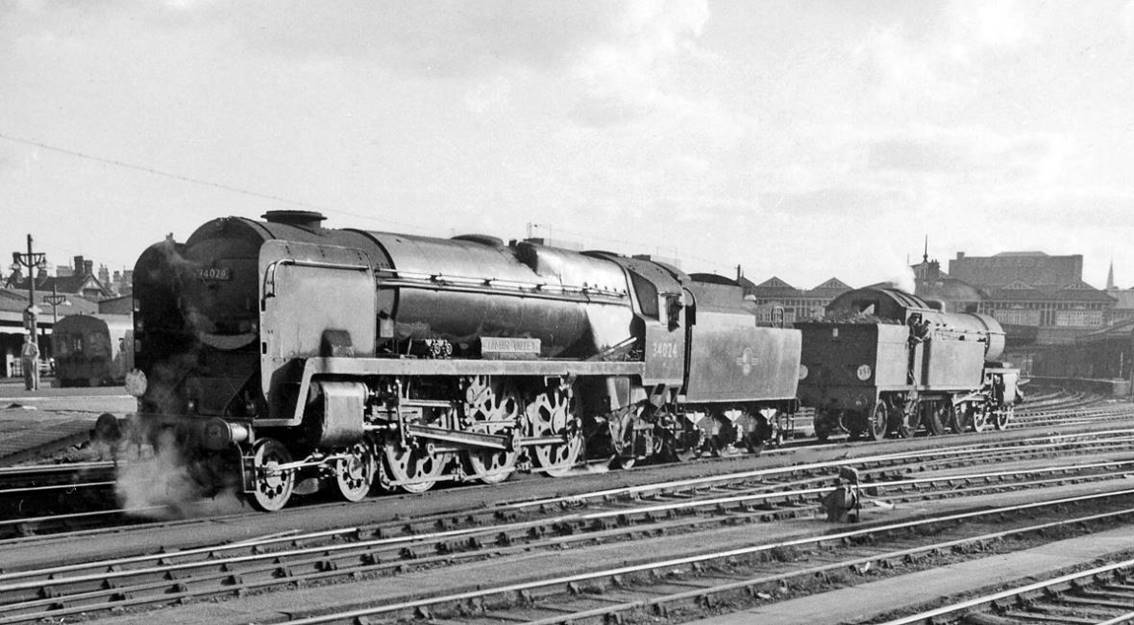 Locomotives in Clapham Junction carriage yard
25th August 1962
From the Down Windsor Line platform across the Carriage Yard to the SW main line. The light engines resting between empty stock workings to Waterloo are: rebuilt Bulleid Light Pacific no.34024 'Tamar Valley' (built February 1946 as no.21C124, rebuilt February 1961, withdrawn at the End of Steam on the SR in July 1967); ex-LSWR Urie class H16 no.30517 (built November 1921, withdrawn December 1962).
© Ben Brooksbank (CC-by-SA/2.0)

