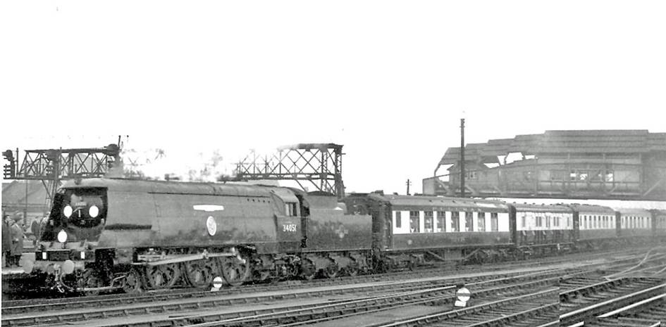 Sir Winston Churchill's Funeral Train passing Clapham Junction
30th January 1965
The train ran from Waterloo to Hanborough via Reading South and Oxford, hauled by SR Bulleid Light Pacific no.34051 'Winston Churchill'. This locomotive was built in December 1946 as no.21C151 and after withdrawal in July 1965 was saved and preserved in the National Collection at York: for the Funeral it carried a unique disc headcode representing 'V for Victory'.
The Pullman liveried hearse vehicle of the seven-coach Pullman train conveyed the coffin - Sir Winston having died on 24th January 1965 then lain in state.
Mid-winter weather precluded my obtaining a good photograph .
Ben Brooksbank (CC-by-SA/2.0)