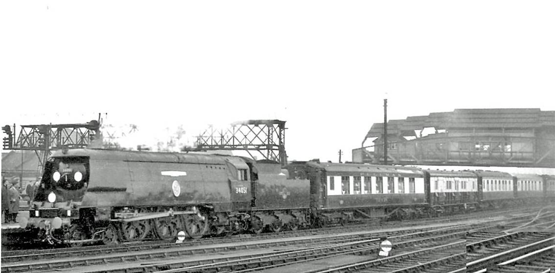 Sir Winston Churchill's Funeral Train passing Clapham Junction
30th January 1965
The train ran from Waterloo to Hanborough via Reading South and Oxford, hauled by SR Bulleid Light Pacific no.34051 'Winston Churchill'. This locomotive was built in December 1946 as no.21C151 and after withdrawal in July 1965 was saved and preserved in the National Collection at York: for the Funeral it carried a unique disc headcode representing 'V for Victory'. 
The Pullman liveried hearse vehicle of the seven-coach Pullman train conveyed the coffin - Sir Winston having died on 24th January 1965 then lain in state. 
“Mid-winter weather precluded my obtaining a good photograph”.
© Ben Brooksbank (CC-by-SA/2.0)
