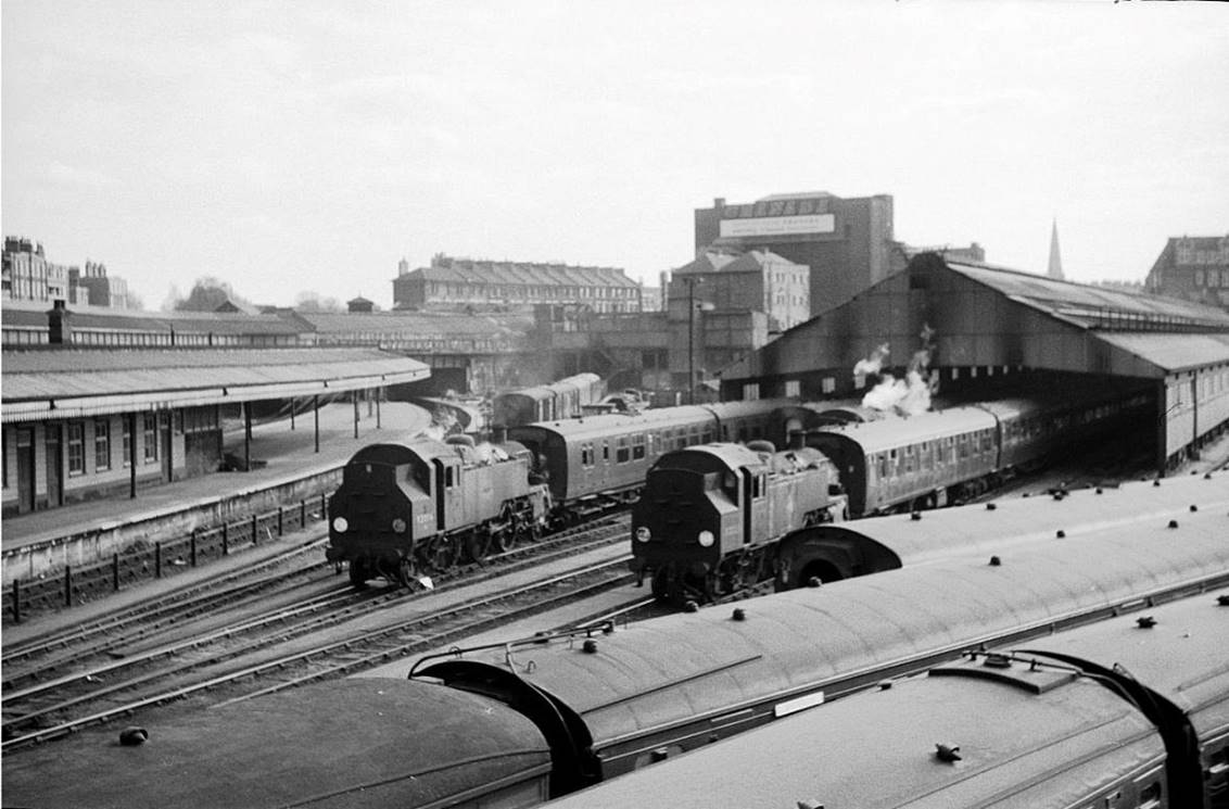 Carriage Sidings, Clapham Junction
26th April 1966
Three BR standard Class 3 2-6-2 tank locomotives wait with sets of coaches ready to take them up to Waterloo Station for service. In the distance is the famous Granada Cinema, now a conference centre and Listed Grade II*.
© Alan Murray-Rust (CC-by-SA/2.0)
