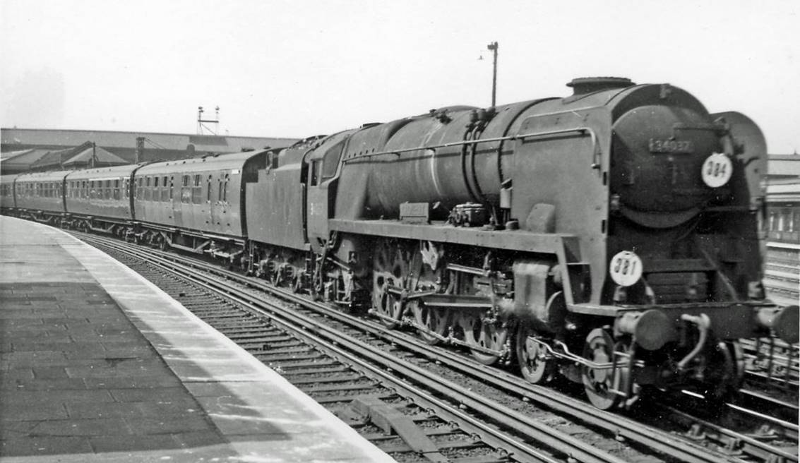 Up Bournemouth express passing Clapham Junction
30th April 1966
Passing through UP Main platform 8, is the 8.46am Bournemouth West to Waterloo behind rebuilt Bulleid Light Pacific no.34037 'Clovelley' (built August 1946 as no.21C137, renumbered March 1949, rebuilt March 1958 and withdrawn July 1967).
“One of the last”.
© Ben Brooksbank (CC-by-SA/2.0)
