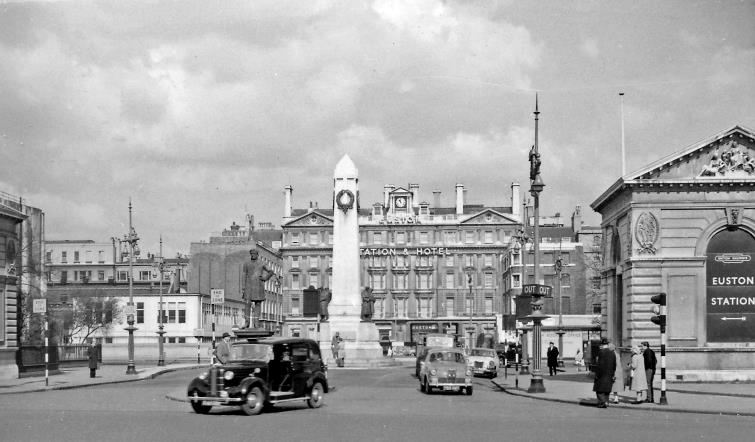 BloodandCustard Euston Station 1962
Euston Station
From Euston Road the entrance to Euston Station after removal of the Doric Arch. The two flanking 'classical' lodges remain, the LNWR War Memorial is prominent. The Station is beyond the Euston Hotel, which also disappeared in the 1960s rebuilding. 
© Ben Brooksbank (CC-by-SA/2.0)
