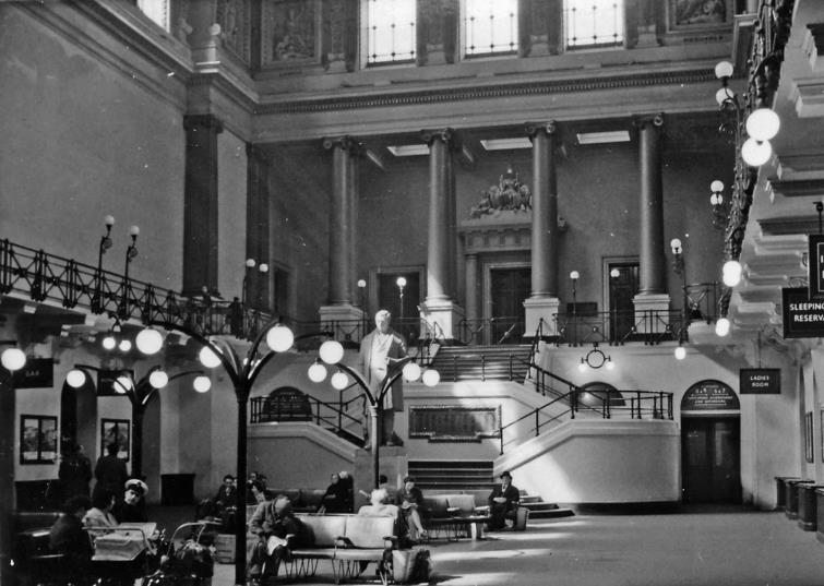 BloodandCustard
Euston Station
Great Hall
10th April 1960
Interior of Great Hall at Euston Station, built by the (then) newly created London & North Western Railway in 1846 at the 1837 terminus of the London & Birmingham Railway. Ahead is the grand staircase leading to the gallery and shareholders' room, past the 1852 statue of George Stephenson. 
Removed in 1961 and weighing around six tones, the marble statue of George Stephenson on its plinth was 15' high. It was commissioned from sculptor Edward Hodges Baily (1788-1867). Picked out in gold, its inscription reads: 
“George Stephenson; Born June 9th 1781; Died August 12th 1848”
“Being a Sunday there are relatively few people around - except the inevitable sleeping drunk. A splendid place for a booking-office, but you normally bought your ticket from a little guichet outside in a narrow passageway. This was all destroyed in 1962.”
© Ben Brooksbank (CC-by-SA/2.0)

