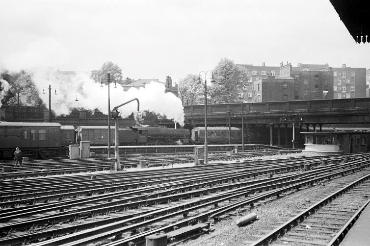 BloodandCustard
Euston Station
April 1960
The station throat with a Black 5 locomotive propelling empty stock under the Ampthill Square Bridge (which has since been demolished). In the foreground are the DC electrified tracks for the local services to Watford which used the fourth-rail system (shared with Bakerloo Line underground trains north from Queens Park).
Alan Murray-Rust (CC-by-SA/2.0)