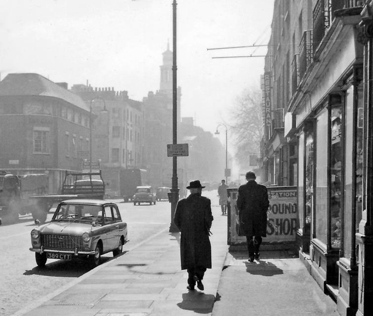 BloodandCustard Euston Station 1962
Eversholt Street
South-east on Eversholt Street at Drummond Street (by Euston Station) towards Euston Road and along Upper Woburn Place to St Pancras Church in the mist. 
This was before the rebuilding of Euston Station in 1966, in which this end of Drummond Street was swallowed up..
© Ben Brooksbank (CC-by-SA/2.0)
