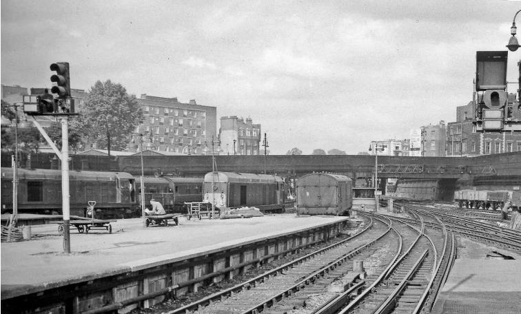 BloodandCustard
Euston Station
Platform 8 
28th August 1963
With more of the New Euston on the left, two Type 1 Diesels now in use on empty stock workings. Ahead, Ampthill Square No. 2 Bridge is still there. 
© Ben Brooksbank (CC-by-SA/2.0)
