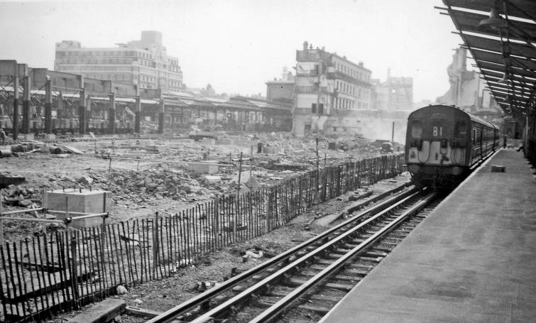 BloodandCustard
Euston Station
Platform 8 
28th August 1963
From the remains of Platform 8, rebuilt and electrified with an EMU waiting to leave for Watford Junction. The inner part of the Main Arrival side is a wasteland, seemingly not able to receive trains. Beyond is Euston House on Eversholt Street.
© Ben Brooksbank (CC-by-SA/2.0)
