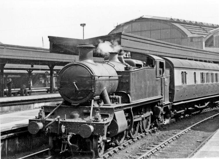 BloodandCustard
Paddington Station
Typical GWR suburban train leaving Paddington
24th April 1948
A local train (probably for Slough and Reading) leaving Platform 6, headed by '6100' Prairie tank no.6114 (built September 1931). From 1931 until 1960 the whole class of seventy '6100s' worked in the London Division, dominating the suburban services. 
Just four months since Nationalisation, this engine is still in Great Western livery and lacking a smokebox number-plate. Right over on the left can be a seen an LPTB Underground train on the Hammersmith & City line.
  Ben Brooksbank (CC-by-SA/2.0)
