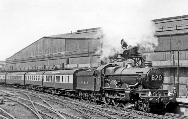 BloodandCustard
Paddington Station
South Wales Express entering Paddington Station
24th April 1948
From the end of Platforms 8/9, towards Platforms 10/11 and Paddington Goods Station 'Castle' no.7001 'Sir James Milne' (built May 1946 as 'Denbigh Castle', renamed February 1948 after the last Chairman of the GWR, withdrawn September 1963) is heading the 7.30am from Carmarthen via Swansea etc. 
Five years later there is a similar scene (25th July 1953) albeit with different boys and more modern coaching stock.
.  Ben Brooksbank (CC-by-SA/2.0)
