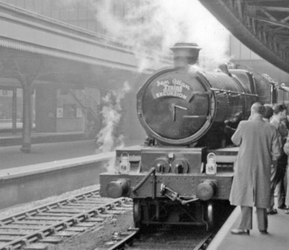 BloodandCustard
Paddington Station
Ian Allan 'Trains Illustrated' Excursion
16th April 1955
Platform 1 at Paddington and: the train is about to leave for a memorable run, by the 'Lickey Limited' to Bristol Temple Meads, then to Birmingham New Street - up the Lickey Bank and back via Bordesley Junction to Paddington. 
This 'Castle' class no.7017 'G.J. Churchward' (built September 1948, withdrawn February 1963) took the excursion to Bristol and, after turning, up as far as Bournville, where Stanier Class 5 no.44842 took over through New Street and round to Bordesley Junction, whence 'Castle' No. 7007 brought the train back up to Paddington. 
  Ben Brooksbank (CC-by-SA/2.0)