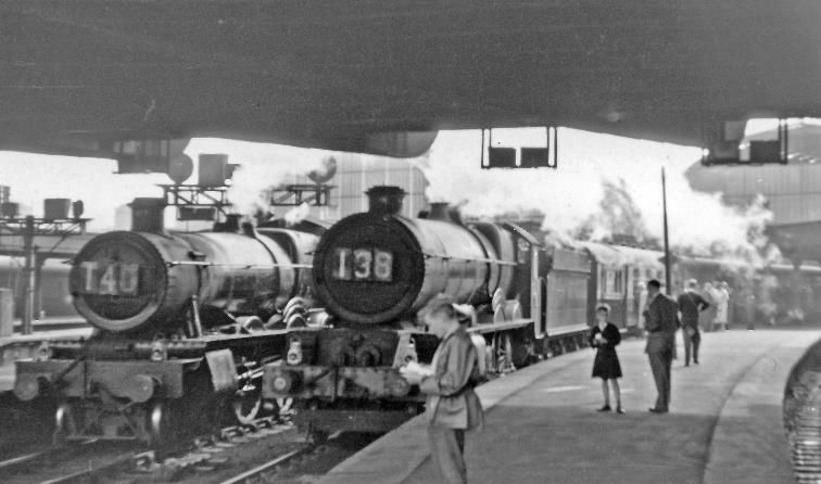 BloodandCustard
Paddington Station
Two expresses for Penzance waiting to leave
25th August 1956
A busy Summer Saturday at Paddington, with two expresses beneath Bishops Bridge for Penzance waiting to leave. With train-spotters watching, at Platform 3,  King  no.6025 'King Henry III' (built July 1930, withdrawn December 1962) is on the 11am to Penzance and Kingsbridge; at Platform 4,  Hall  no.5941 'Campion Hall' (built February 1935, withdrawn Septem,ber 1962) heads the 11.5am to Penzance. 
  Ben Brooksbank (CC-by-SA/2.0)