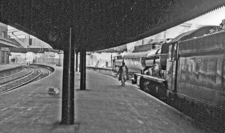 BloodandCustard
Paddington Station
Paddington Station, exit on Departure side
2nd February 1957
Towards Bishops Bridge from near the end of Platforms 2/3, on the right at Platform 3, 'King' no.6004 'King George III' waits to leave on the 'Merchant Venturer', 11.15am to Bristol and Weston-super-Mare.
  Ben Brooksbank (CC-by-SA/2.0)