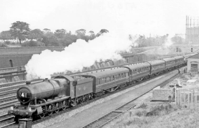 BloodandCustard
Mitre Bridge
31st August 1957
The rare sight of a 47XX 2-8-0 on passenger work at Mitre Bridge. Only on Summer Saturdays were these 'Night Owl' 47XX class 2-8-0s employed on express work, usually as here on the 12.5pm Paddington   Plymouth. No 4700 (built May 1919, withdrawn October 1962) is approaching Old Oak Common East. 
 Apologies for the poor quality, but perhaps justified by rarity .
  Ben Brooksbank (CC-by-SA/2.0)