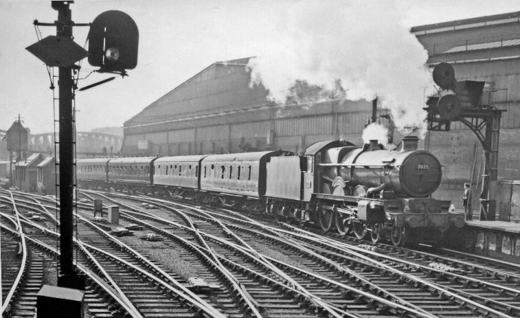 BloodandCustard
Paddington Station
Worcester Express entering Paddington Station
4th May 1959
'Castle' no.7025 'Sudeley Castle' (built August 1949, withdrawn September 1964) is terminating at Platform 10 at Paddington, the train having left Wolverhampton at 2.15pm to run via Stourbridge Junction and Kidderminster to Worcester, then to London via Oxford. Behind, and beyond the Underground's Hammersmith & City lines, is the great Paddington Goods station.
  Ben Brooksbank (CC-by-SA/2.0)