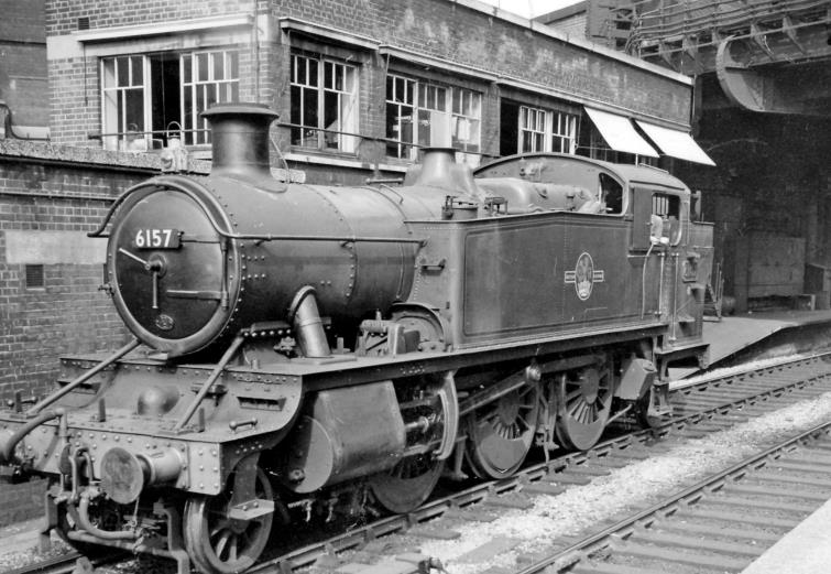 BloodandCustard
Paddington Station
'6100' class 2-6-2T by Paddington Arrival Signalbox
4th June 1959
From Platform 7 towards buffers along No. 8: the Arrival side of the ex-GWR London Terminus. Collett '6100' class no.6157 is one of the whole class of seventy that worked the suburban services; it was built March 1933, withdrawn May 1962. Bishops Road Bridge is above.
  Ben Brooksbank (CC-by-SA/2.0)