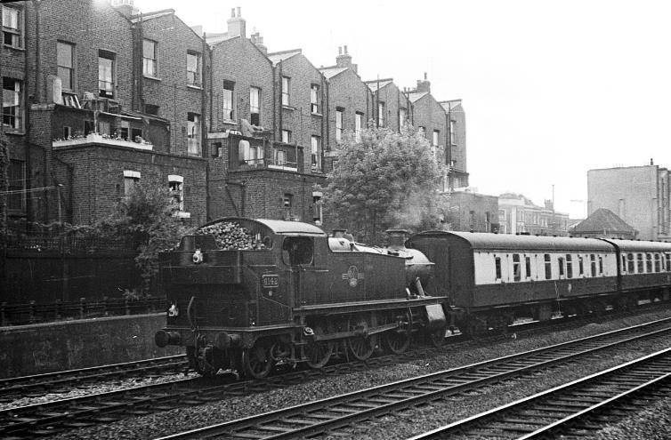 BloodandCustard
Paddington Station
Near Westbourne Park 
April 1960
Large prairie locomotive no.6142 brings a rake of empty coaches into Paddington for an express working. This class of locomotive formed the principal motive power for commuter services out of Paddington as well as doing empty stock work.
The houses in the background have been replaced by modern maisonettes.
 Alan Murray-Rust (CC-by-SA/2.0)
