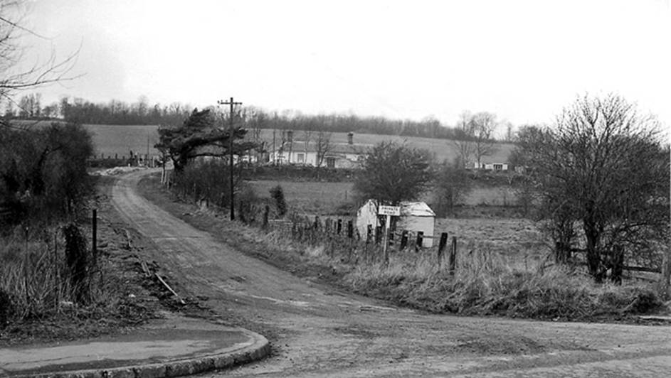 Barham
(Closed)
View from the east along the former station road /across the fields to the remains of Barham Station (16th April 1963), which had been on the Elham Valley line from Canterbury to Shorncliffe. In the photograph the railway ran left to right.
This line had an unusual history, as the line was taken over by the War Office (Army) on 1st December 1940 to provide access for big rail-mounted guns to assist in the repelling of any invasion. However, a public service was maintained from Lyminge to Shorncliffe until 3rd May 1943 (goods until 1st October 1947).
Following closure, the station was made into a house. Now covered by a housing estate the area is unrecognisable today.
Ben Brooksbank (CC-by-SA/2.0)