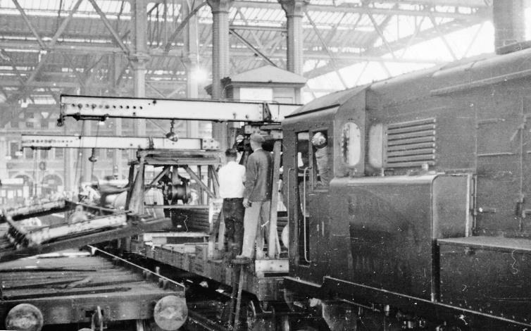 Waterloo Station: relaying train with SR 0-6-0DE
19th July 1948
Towards buffers at Platform 4 with relaying work in progress, employing one of the just three ex-SR 0-6-0DE 350hp shunters, no.1 (later 15201), built 1937.
  Ben Brooksbank (CC-by-SA/2.0)