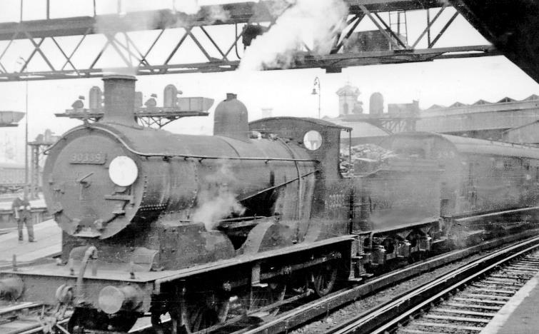Farnborough Air Display special at Waterloo
8th July 1950
Rail travel from London to one of the first post-war Air Displays at Farnborough was provided to the ex-LSWR station at Farnborough. This produced some most unusual sights at Waterloo. Here, probably at Platform 10, is an ex-LSWR Drummond '700' class no.30339 (built June 1897 as no.710, soon renumbered 339, and as BR no.30339 lasted until November 1962). The Special was at least made up of SR carriage stock, unlike some which had ex-Metropolitan stock.
  Ben Brooksbank (CC-by-SA/2.0)