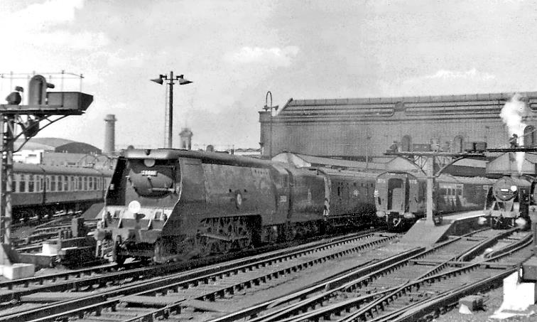 Pioneer Bulleid 'Merchant Navy' Pacific on Down express
11th July 1953
View northward from platform 11, with no.35001 'Channel Packet'- the very first of Bulleid's Pacifics (built June 1941, rebuilt August 1959, withdrawn November 1964) on the 3.00pm departure to Exeter and Plymouth, Ilfracombe & Torrington.
Although the coaching set behind no.35001 cannot be ascertained, Bulleid 59   multidoor  stock 3-set 975 has arrived in platform 10.
  Ben Brooksbank (CC-by-SA/2.0)
