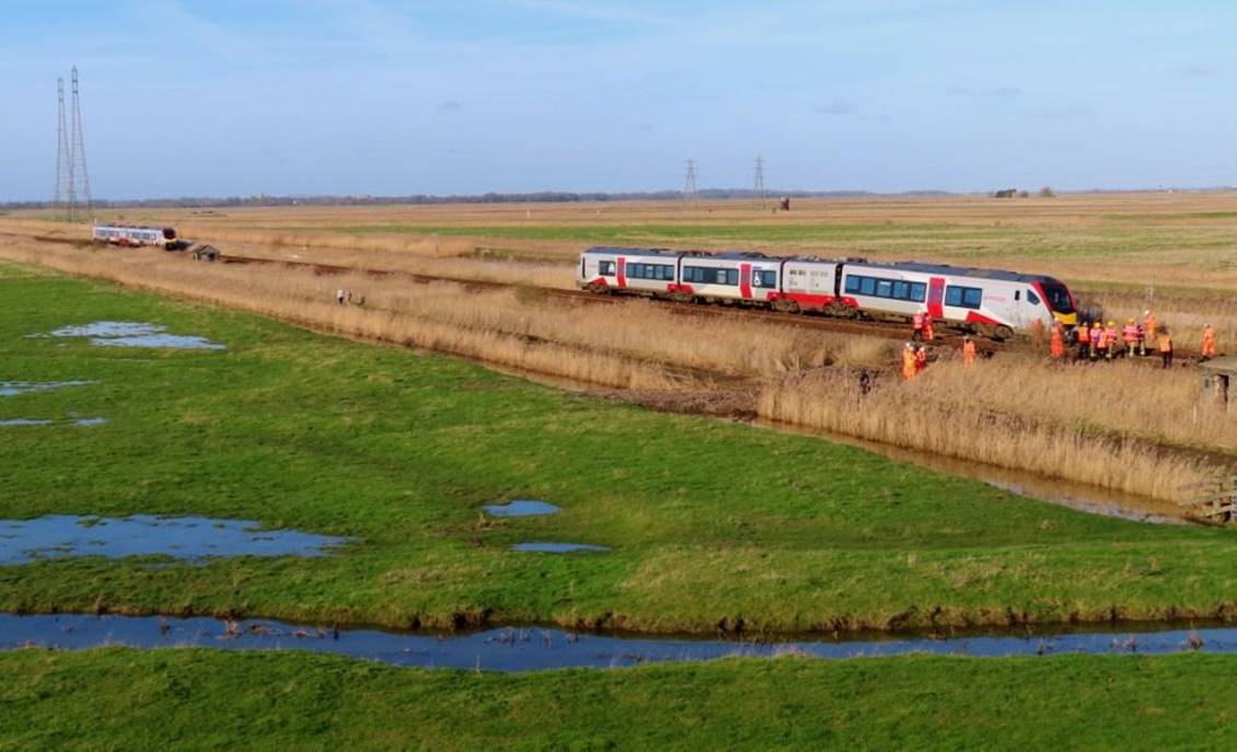 A train travels down the tracks

Description automatically generated