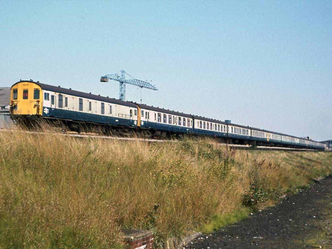 Saturday, 19th August 1978 and an unidentified MLV is at the rear of a CEP-BEP-CEP Down boat train formation passing Chart Leacon Works on the approach to Ashford.
© Tony Watson

