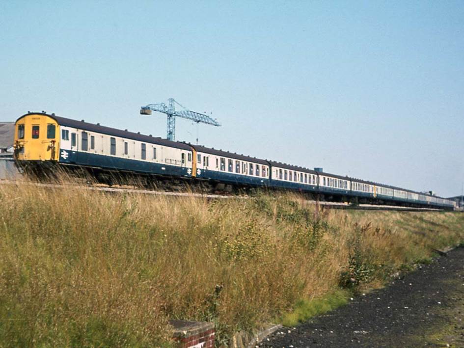 Saturday, 19th August 1978 and an unidentified MLV is at the rear of a CEP-BEP-CEP Down boat train formation passing Chart Leacon Works on the approach to Ashford.
 Tony Watson
