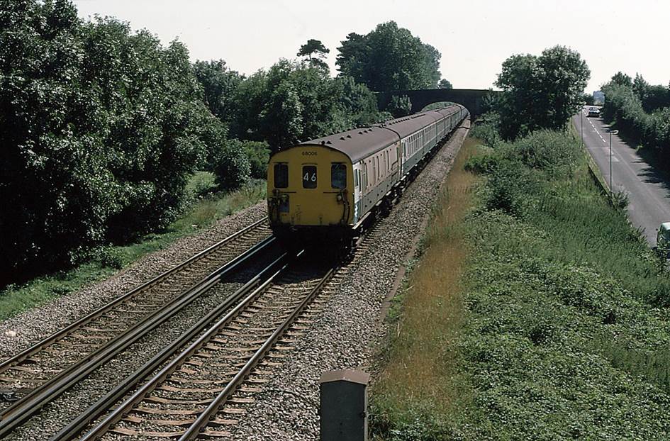 BloodandCustard MLV
No.68006 leading a Dover Western Docks to Charing Cross service has just passed under Boys Hall Road in the days when it connected with Crowborough Road on the right. Scene is very different today as a concrete bridge now takes Boys Hall Road across both along with High Speed 1 (which runs to the left of the main line).
 Martin Addison (CC by SA 2.0)
