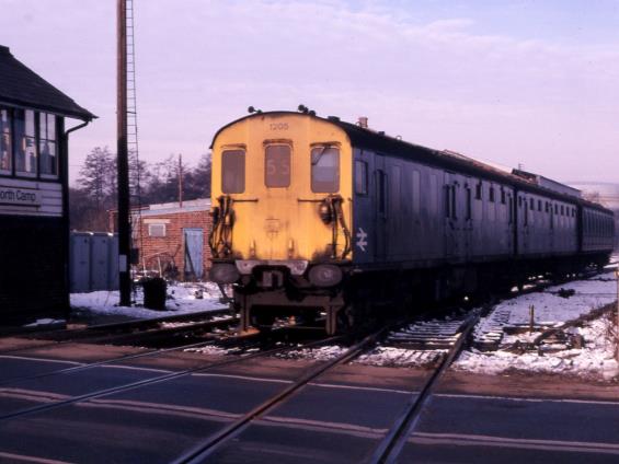 Unit no.1205 is about to pass over the level crossing 
at North Camp on Saturday, 6th January 1979.
 Tony Watson
