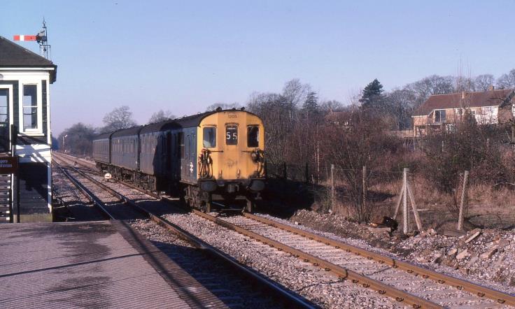 3R unit no.1205 rolls into Edenbridge on a bright Saturday 3rd February 1979 with a Reading to Tonbridge working. Note the green enamel sign still survived on the signalbox door. The mechanical signals, signalbox and crossover are now long gone.
© John Atkinson
