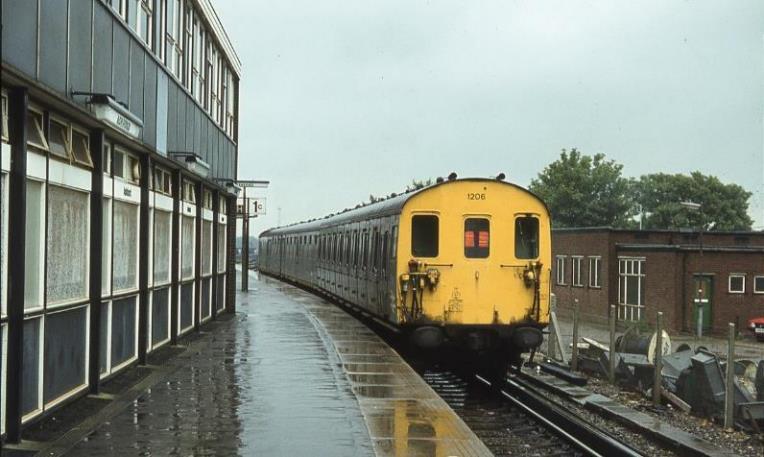 In torrential rain unit 1206 departs from Ashford. 
Note at this point it retains its 6S motor-coach.
 BloodandCustard
