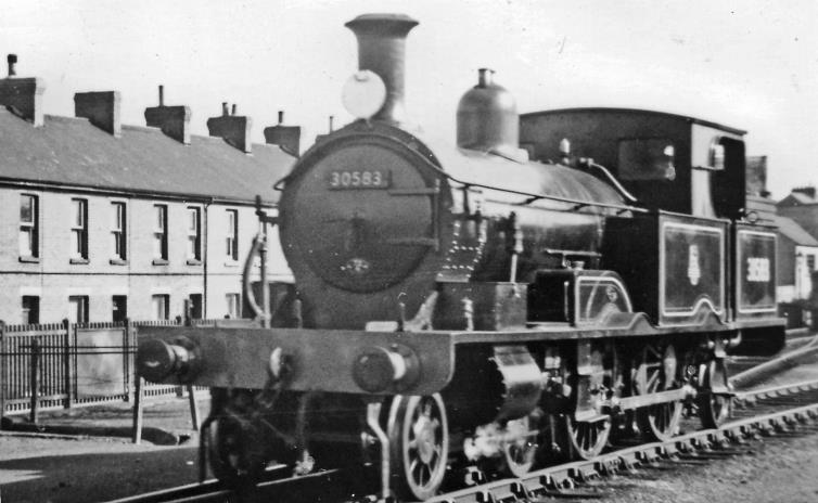 Exmouth
Ian Allen Ltd
Loco Spotters Club / Trains Illustrated Specials &
Branch Line Tour with Veteran Locomotives
12th April 1953 saw a multiple-train Rail Tour arranged by Ian Allan Ltd., with (175 intended but not achievable due to engineering works) high-speed runs from Waterloo to Exeter (Central) and back. The first return train from Waterloo was 09.20am Loco Spotters Club, the second 10.00am Trains Illustrated Special
No. 30583 was one of the LSW Adams '0415' class which survived much longer than most of the class as it was needed for working on the lightly-built Lyme Regis branch. It was built March 1885 as No. 488, then as no. 0488 in the Duplicate list was withdrawn in September 1917 and sold to the Ministry of Munitions who employed it at the Ridham Salvage Depot, Sittingbourne. In April 1919 it was bought by the East Kent Light Railway and numbered 5. 
It worked on that line for eighteen years, then lay derelict at Shepherdswell for two years. However, it was re-acquired by the SR eventually in March 1946, restored after the War and put to work on the Lyme Regis branch in Dember 1946, where it worked until July 1961. It is now preserved by the Bluebell Railway. 
© Ben Brooksbank (CC-by-SA/2.0)
