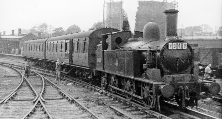 Aylesbury High Street
Inter-Regional Ramblers Special
Ramblers' Association /RCTS combined Tour
South towards buffer-stops on 10th October 1954, this terminus of the ex-London & North Western branch from Cheddington was already closed to passengers (from 2nd February 1953). However, remained for goods until 2nd December 1963.
However, the RCTS (Railway Correspondence & Travel Society) were able to include the branch in their complex 'Buckinghamshire Rail Tour', motive power being ex-London & North Western 'Coal Tank' 2F no. 58887.
 Ben Brooksbank (CC-by-SA/2.0)
