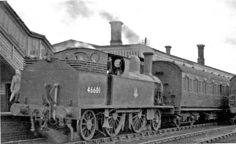 Cheddington
Last day of service to Aylesbury High Street
31st January 1953
View towards London on the WCML, junction of the branch to Aylesbury High Street. An early branch line, it opened 10th June 1839 to Aylesbury (with that station relocated 16th June 1899 and renamed Aylesbury High Street in 1953), closed to passengers 2nd February 1953, goods 2nd December 1963. 
One of the last trains, being on the Saturday stands at the branch platform at Cheddington, with ex-LNW Webb 5'6" 1P no.46601.
 Ben Brooksbank (CC-by-SA/2.0)
