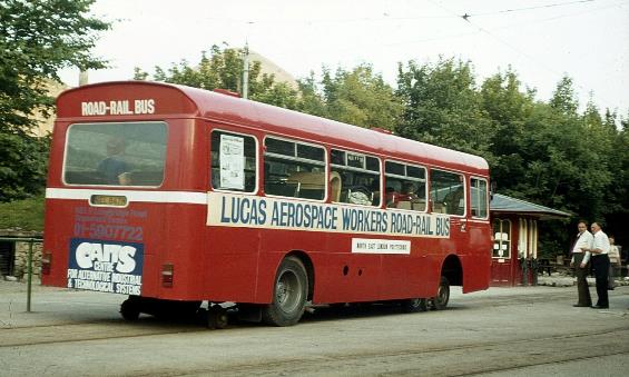 A red bus parked on the side of a road

Description automatically generated with medium confidence