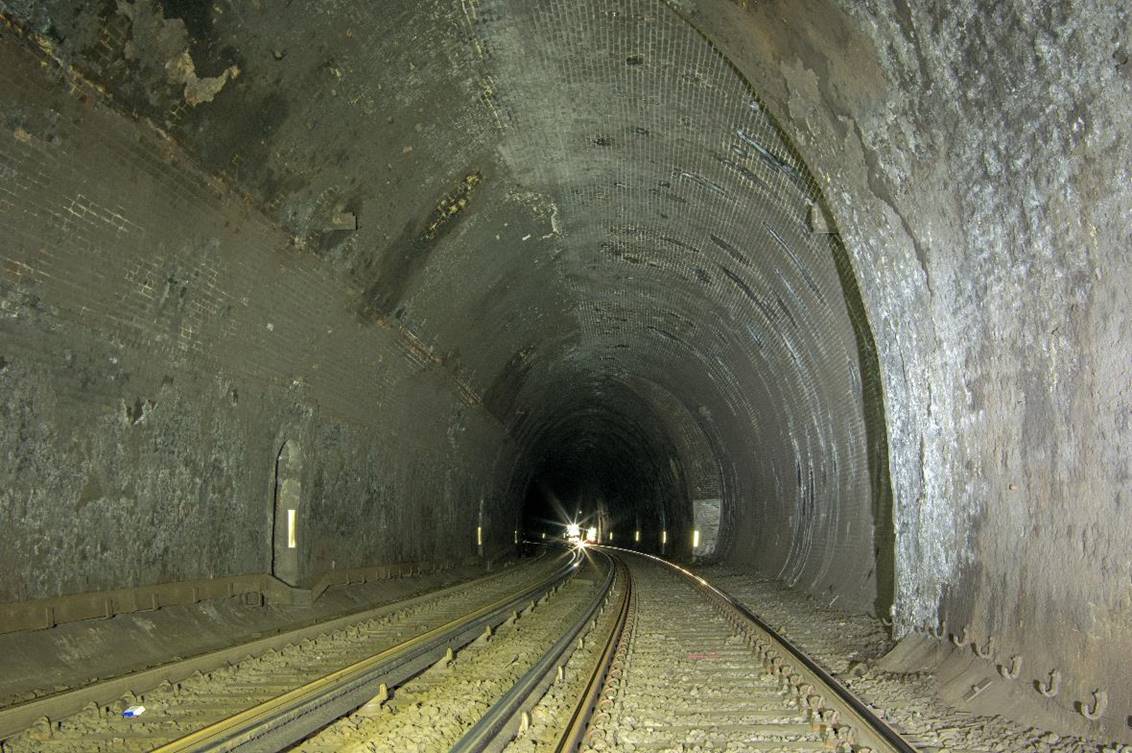 www.BloodandCustard.com

High in the arch (above the refuge -left and the dark stain - right) the 
remaining ends of a LBSCR overhead electrification gantry are visible.
 Adrian Backshall
