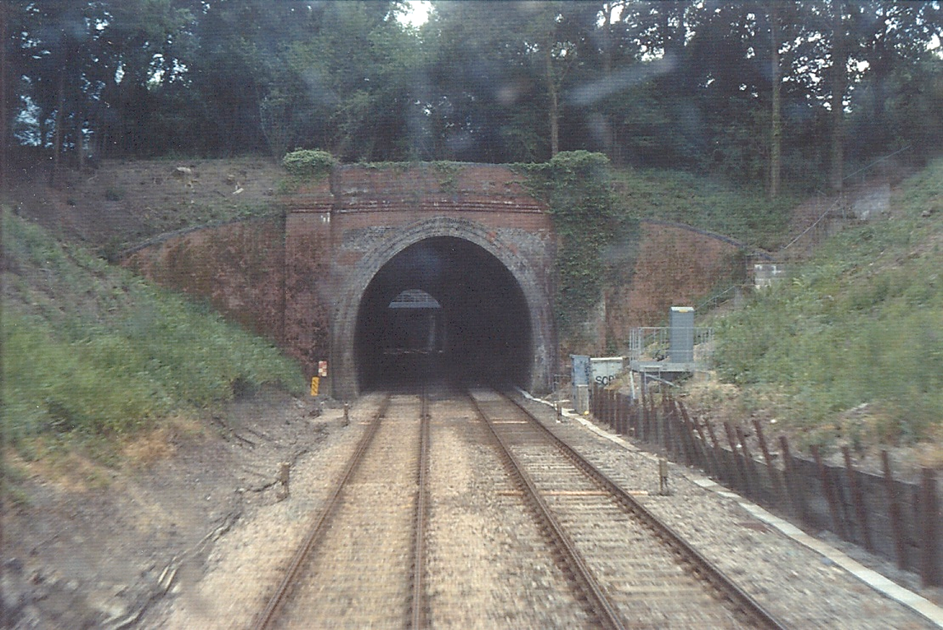 BloodandCustard
Edenbridge Tunnel's .London-end of the northern tunnel on Down Line.
(from the Secondman’s Forward Observation Light of unit no.207 202).
© Colin Watts (16th April 2004)
