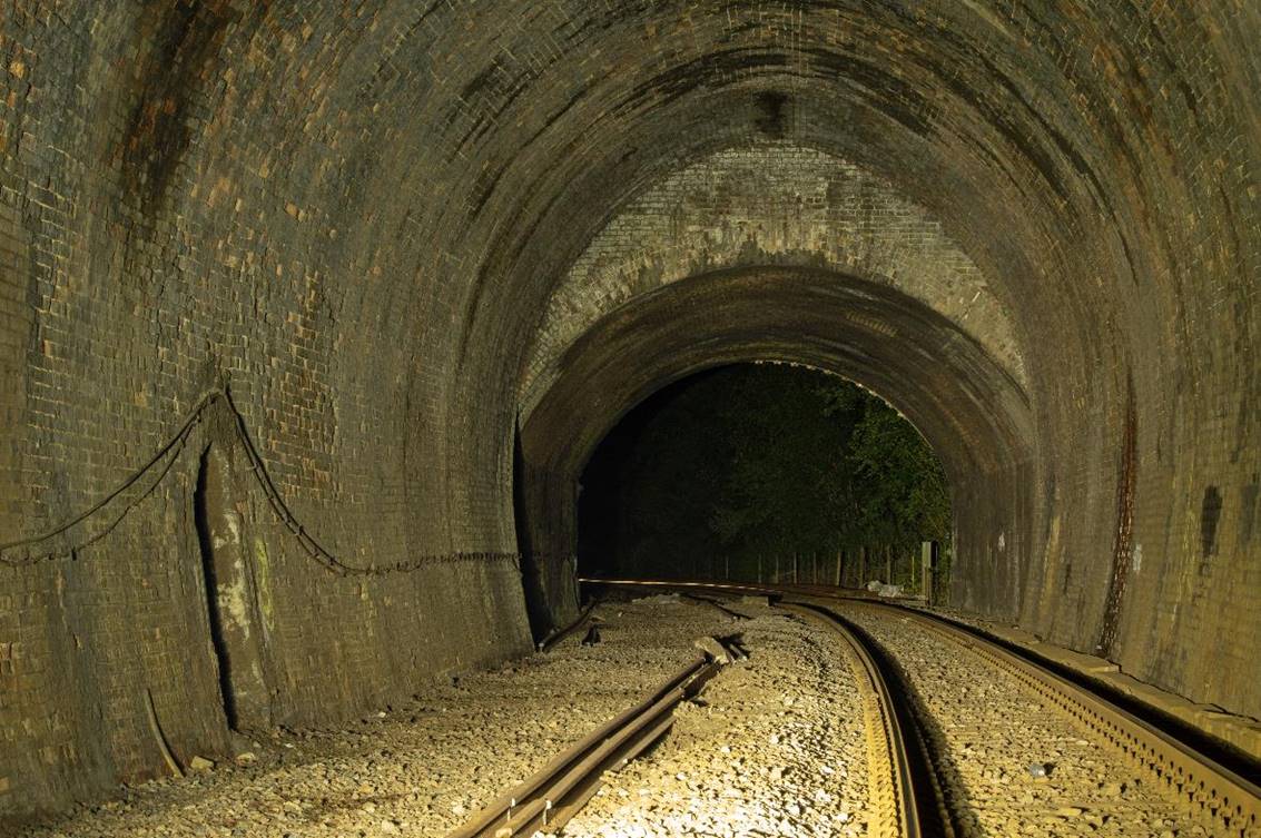 https://www.bloodandcustard.com/BR-Tunnels-MarkBeech.html

South on the 63-chain curve towards Cowden station, the tunnels 
high main arch, cut-and-cover section to the south-end portal.
 Adrian Backshall
