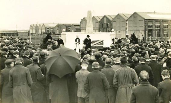 A crowd of people watching a person on a stage

Description automatically generated with low confidence