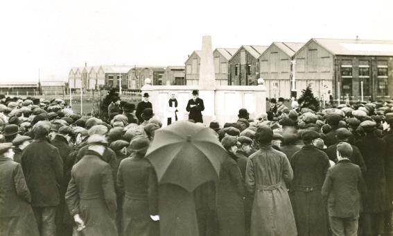 A crowd of people in front of a building

Description automatically generated with medium confidence