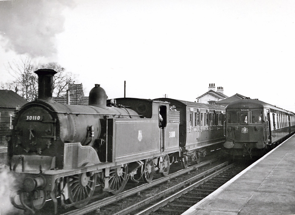 Unit no.3053 has just arrived at Brighton (with unit no.3052 leading) on the 11.00 from Victoria on Sunday, 2nd March 1969. Note the oil tail lamp.
By this date unit no.3053 was the only unit of the three still running in its original umber & cream Pullman colours although the cab end crest has already been obliterated by the yellow warning panel (during its overhaul at Eastleigh in January 1967). 
Unit no.3053 went to Eastleigh just four weeks later for its final overhaul into Blue /Grey livery. Car 93 (nearest to camera) survives today (stored at Stewarts Lane). 
© John Hayward.

