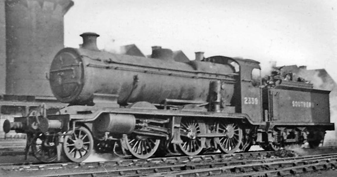Brighton Locomotive Depot
Bulleid's first 'Leader' at Brighton on 18th December 1949 no. 36001 was the prototype of Bulleid's revolutionary design of steam engine, nominally an 0-6-6-0T, and the only example that was actually completed (in June 1949). It ran a number of trials on the Southern Region for some months, but never worked a service train before the project was cancelled in 1951 owing to its various serious drawbacks.
“Seen from a train just outside Brighton Station, this rather poor snap was nevertheless an unusual 'cop'”.
© Ben Brooksbank (CC-by-SA/2.0)
