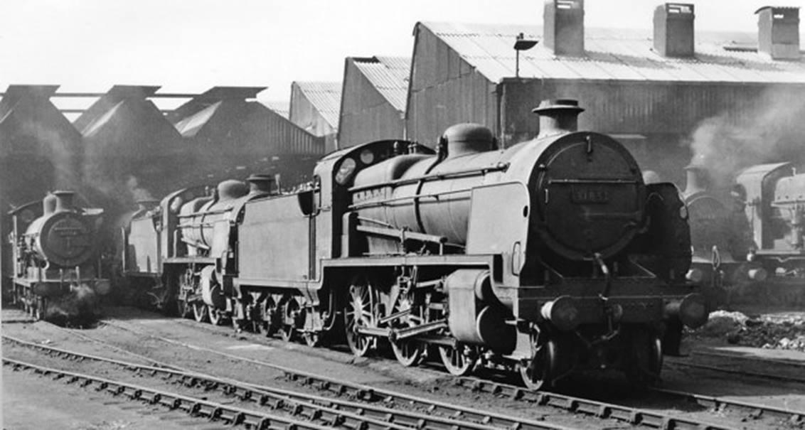 The prominent 2-6-0 is ‘Woolwich’ Maunsell N class no.31851. Ex. works 19th January 1925 as no.A851, it is seen here with tender no.3040. The locomotive was withdrawn on 25th August 1963.
© Ben Brooksbank (Geograph/CC-by-SA)
