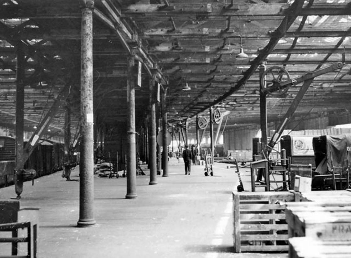 Bricklayer's Arms Goods Depot  interior view south-east of one of the several loading-banks of the extensive Goods Depot and Locomotive Shed complex that constituted one of London's largest Railway Depots. 
It was at the west end of a branch from Bricklayer's Arms Junction and was the original terminus of the South Eastern Railway from 1st May 1844 to just eight years later. It was closed to passengers in January 1852 and to Goods over 125 years later on 1st August 1977.
 Ben Brooksbank (Geograph/CC-by-SA)
